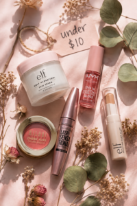 "Flat-lay of 13 best budget beauty products under $10, including skincare, makeup, and haircare drugstore picks that actually work."